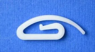 Závěsný háček na závěs a záclon.Šnek